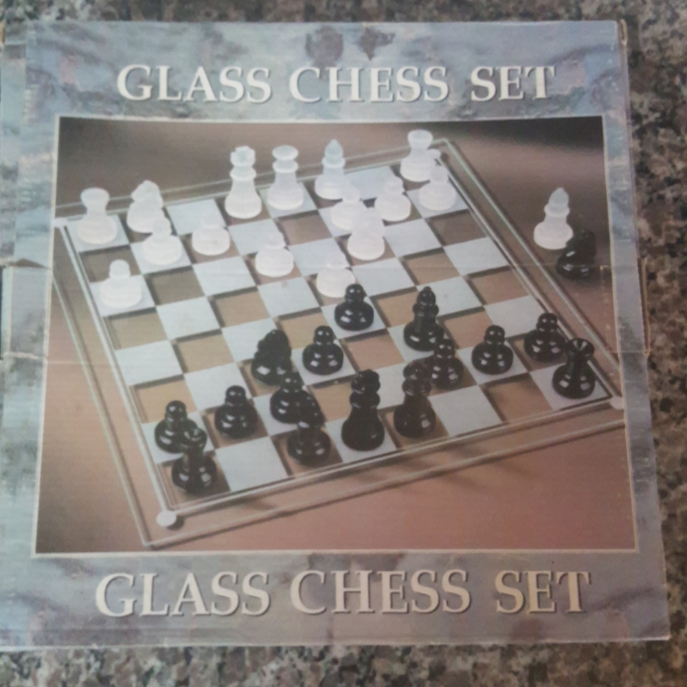 Glass chess set 9.5".  Complete in box.